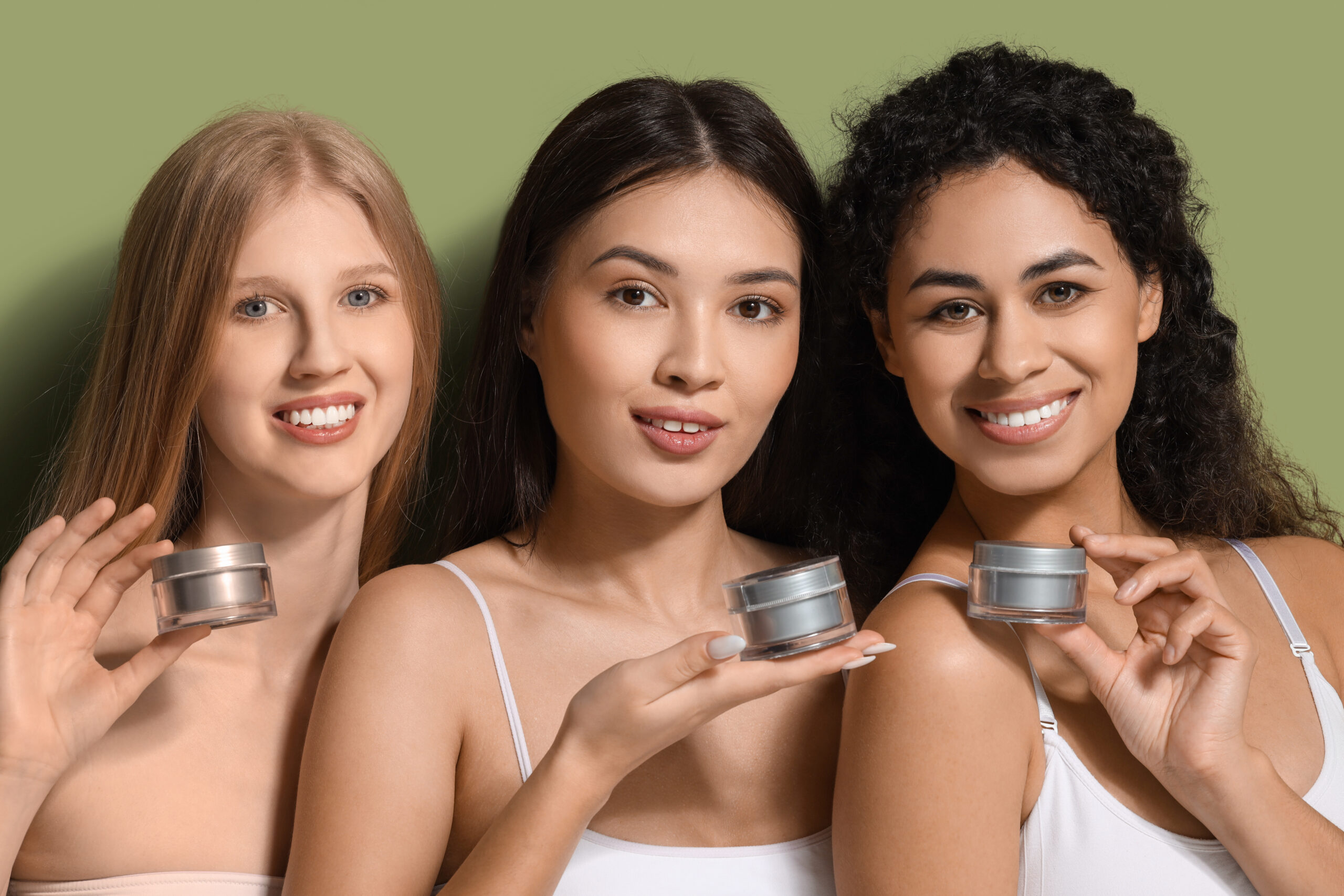 women holding green skincare
