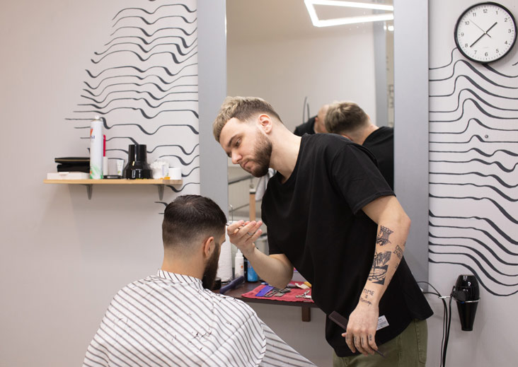 barber student cutting hair