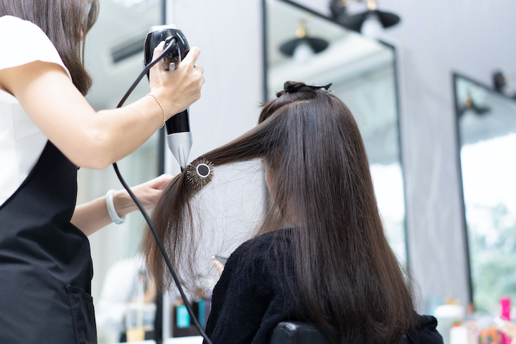 blow drying and styling hair