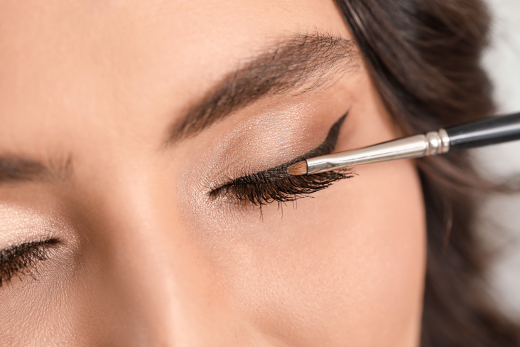 applying black liner