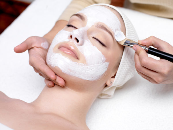 woman in salon getting a facial