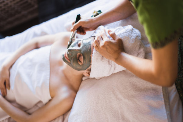 woman getting a facial in a spa