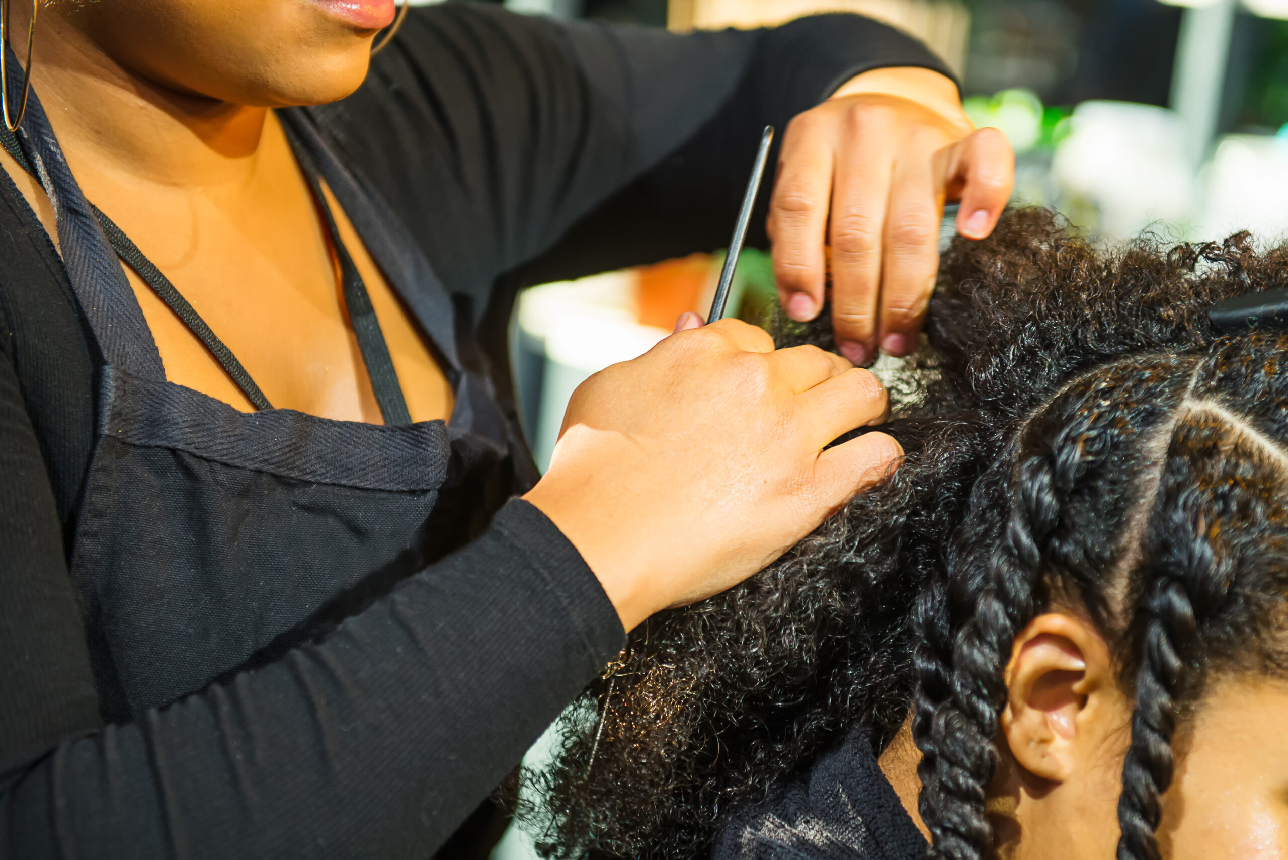 hair stylist braiding hair
