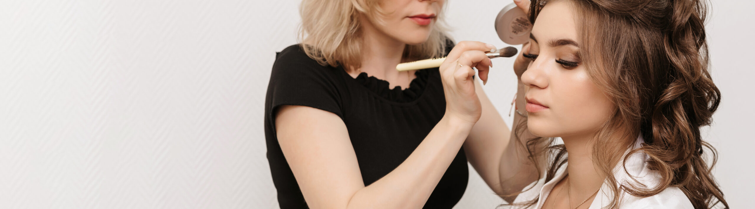 makeup artist applying eyeshadow