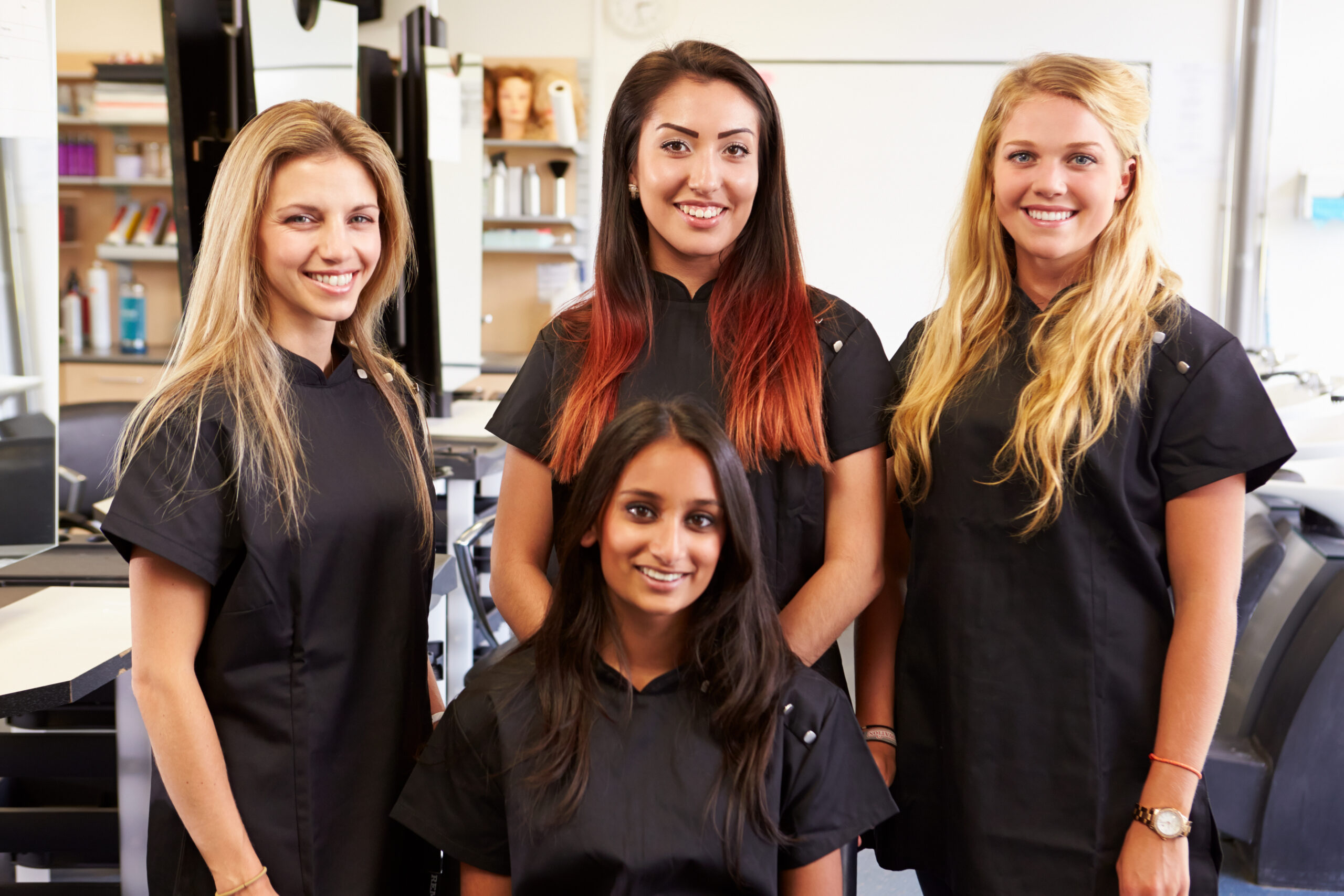women posing in campus salon