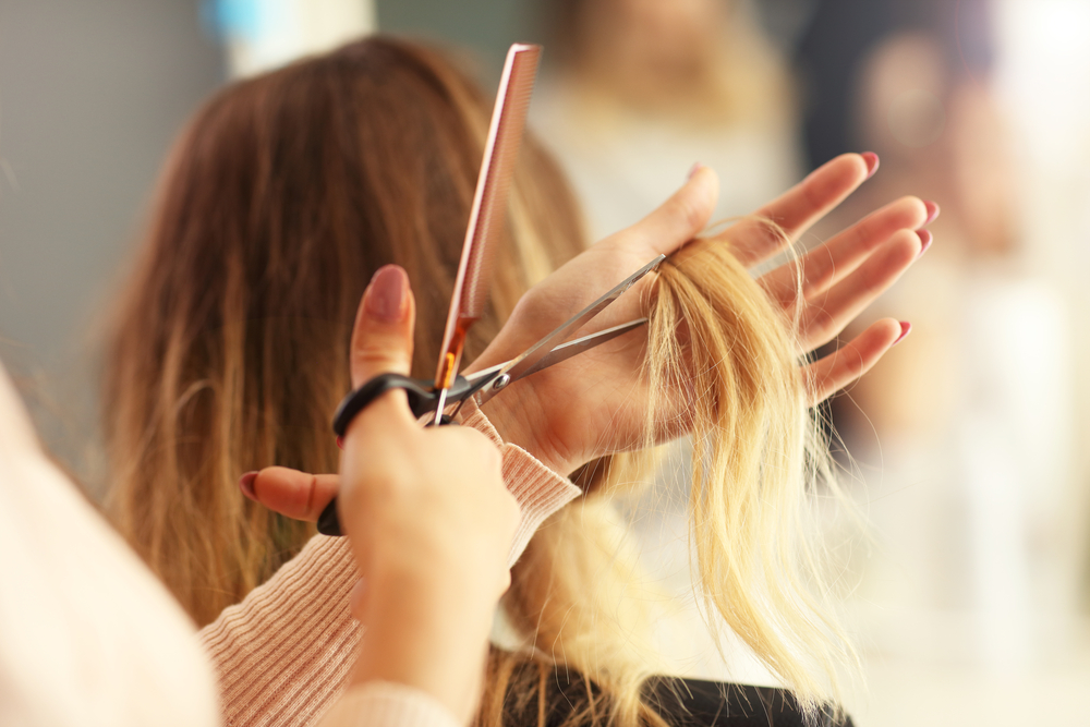 woman getting her hair cut