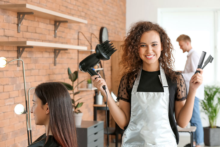 hairstylist holding tools