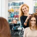 hairdresser doing client's hair