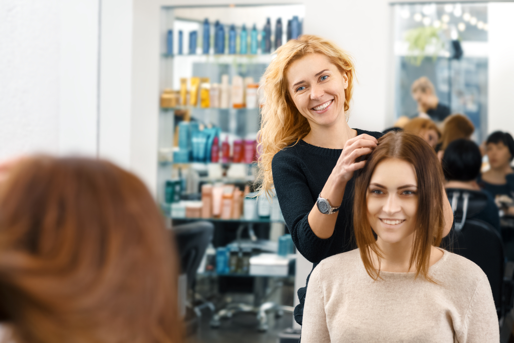 hairdresser doing client's hair