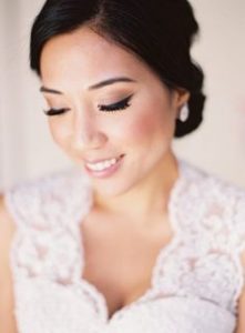 Keeping your hair pulled back allows your groom, photographer and guests to focus on your glowing face. 