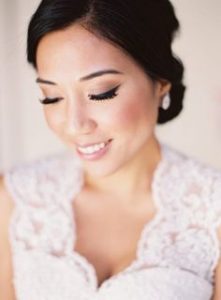 Keeping your hair pulled back allows your groom, photographer and guests to focus on your glowing face.