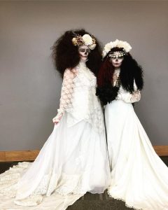 pair of girls as skeleton brides