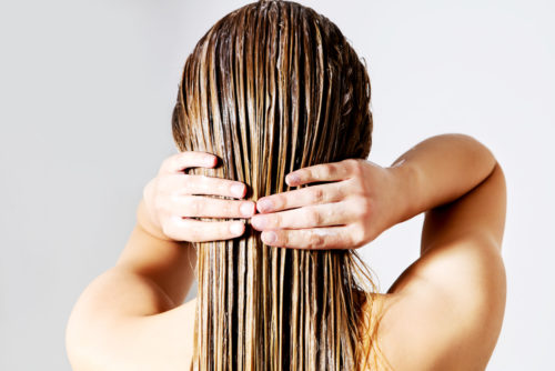 woman applying conditioner