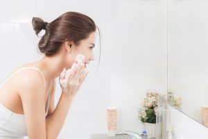 woman washing face