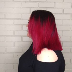 Red vibrant hair with shadow root