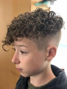 boy with permed hair and fade