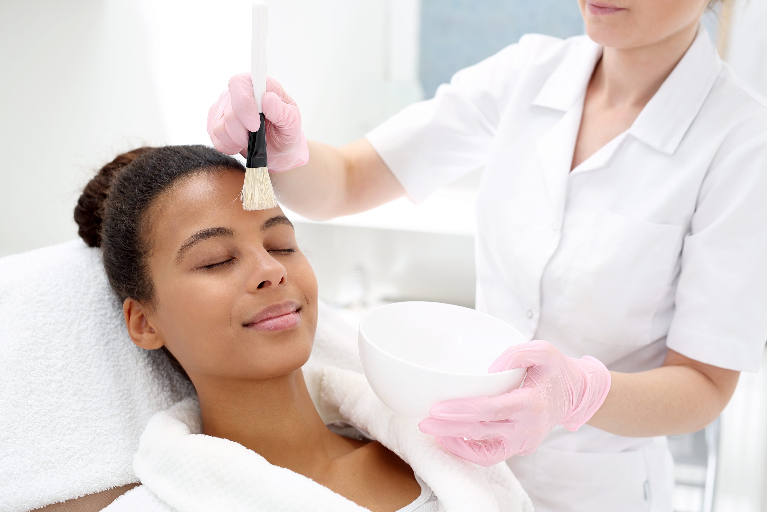 Esthetician doing a facial