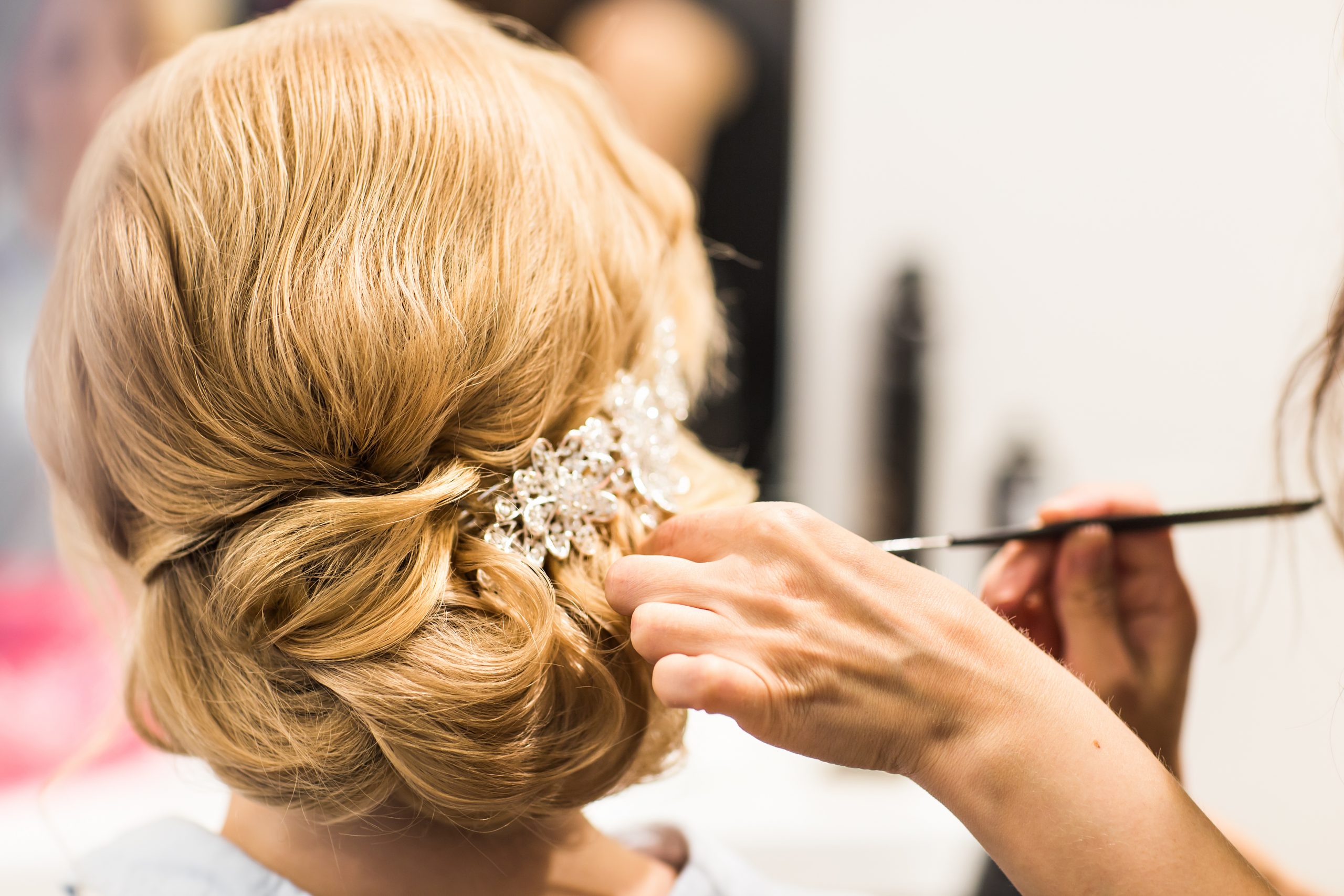 Bridal Hairstylist fixing hair