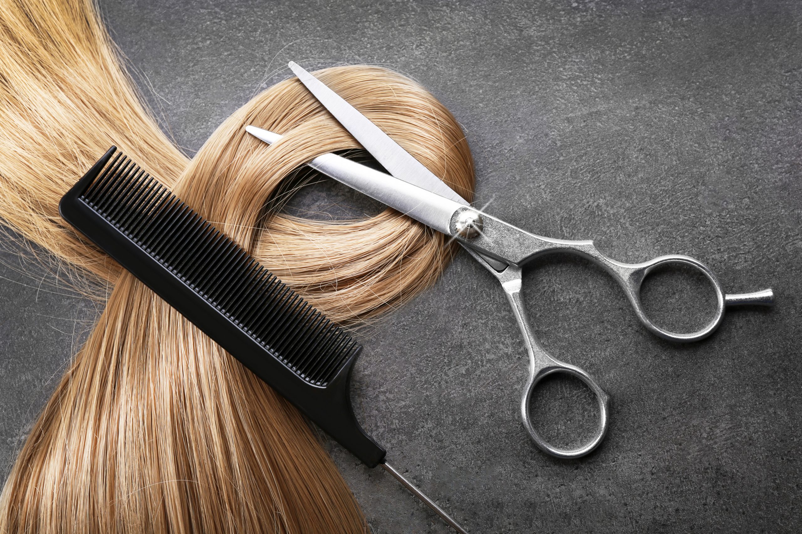 Scissors with hair and comb