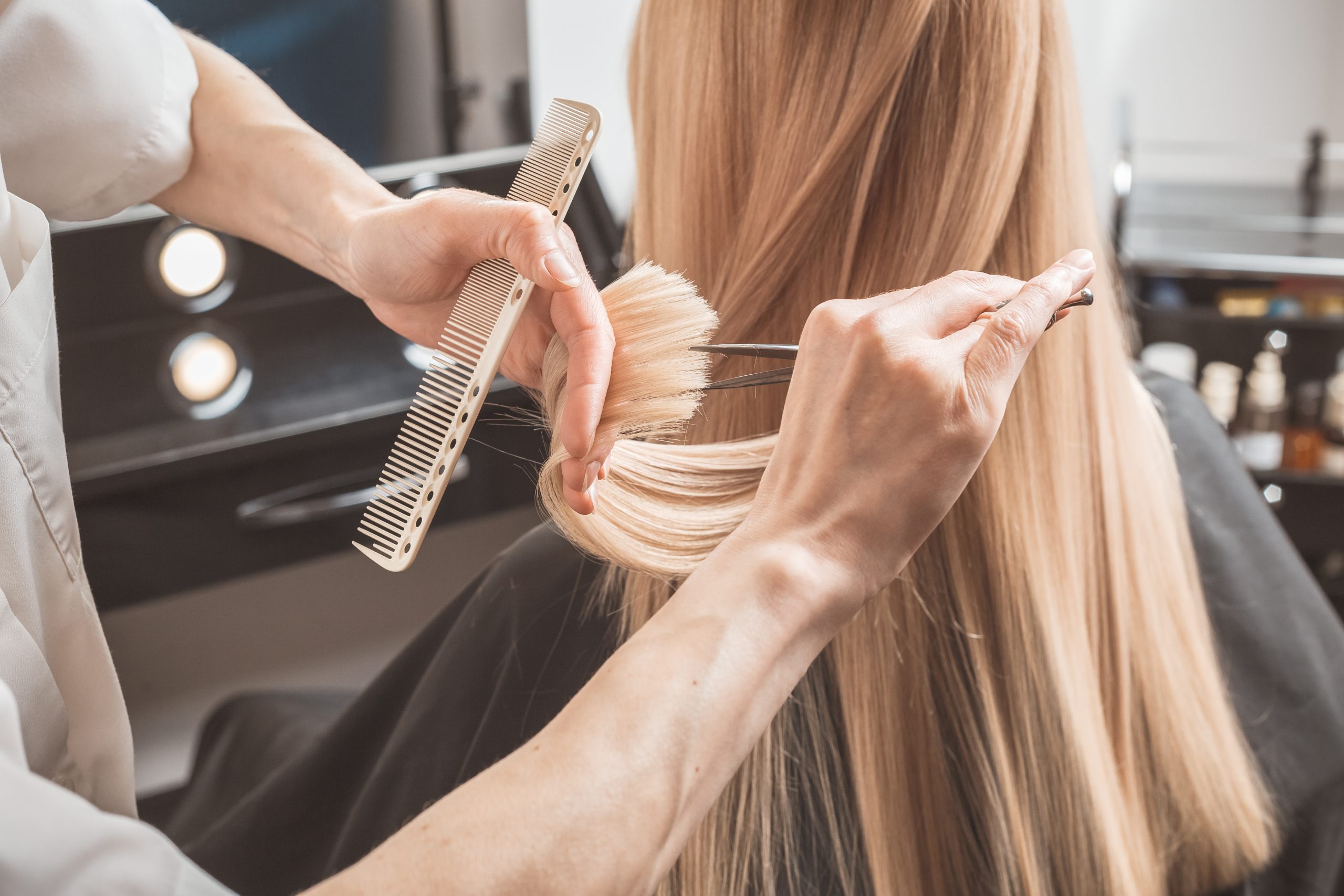 Hairstylist cutting hair