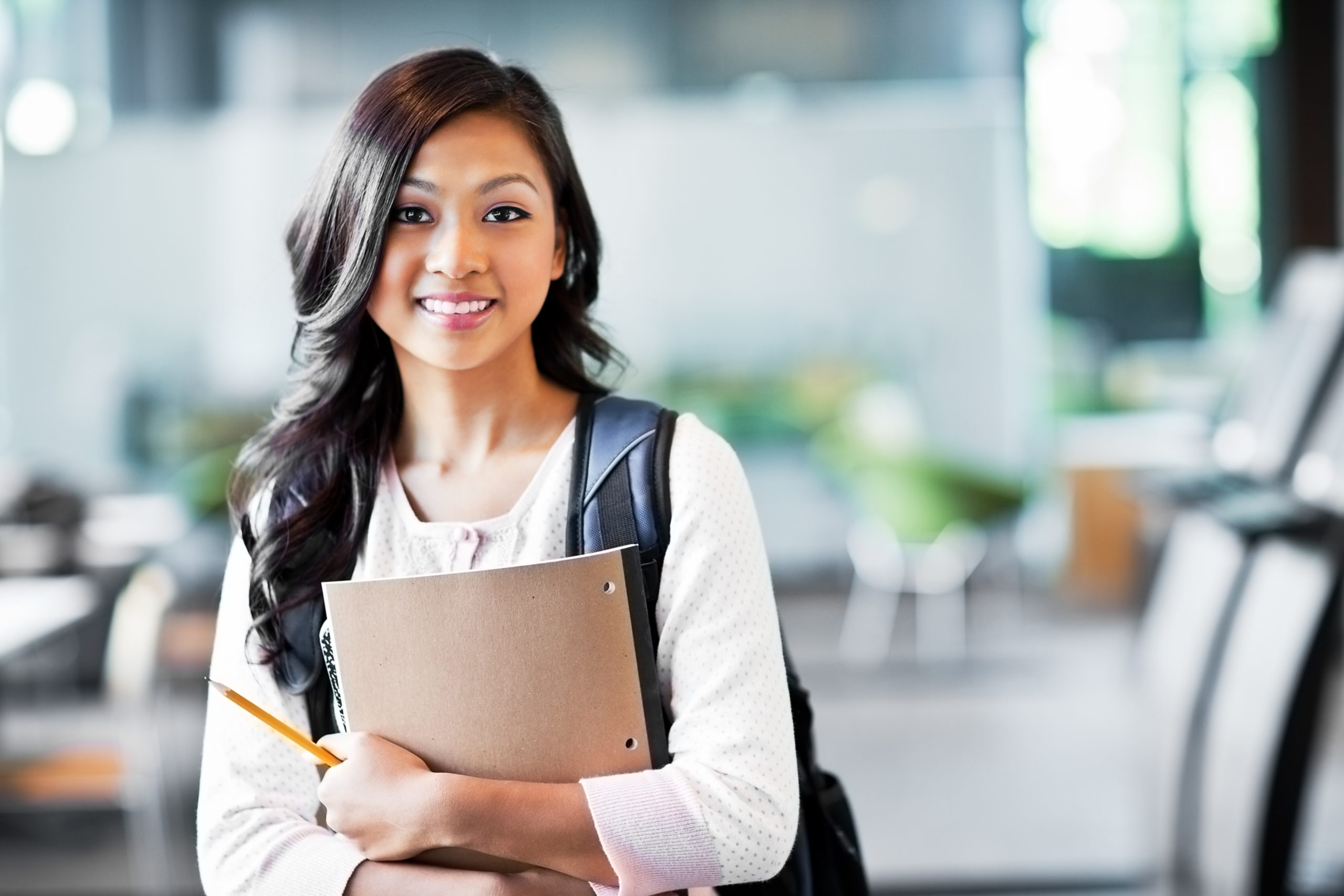 Student holding studying material