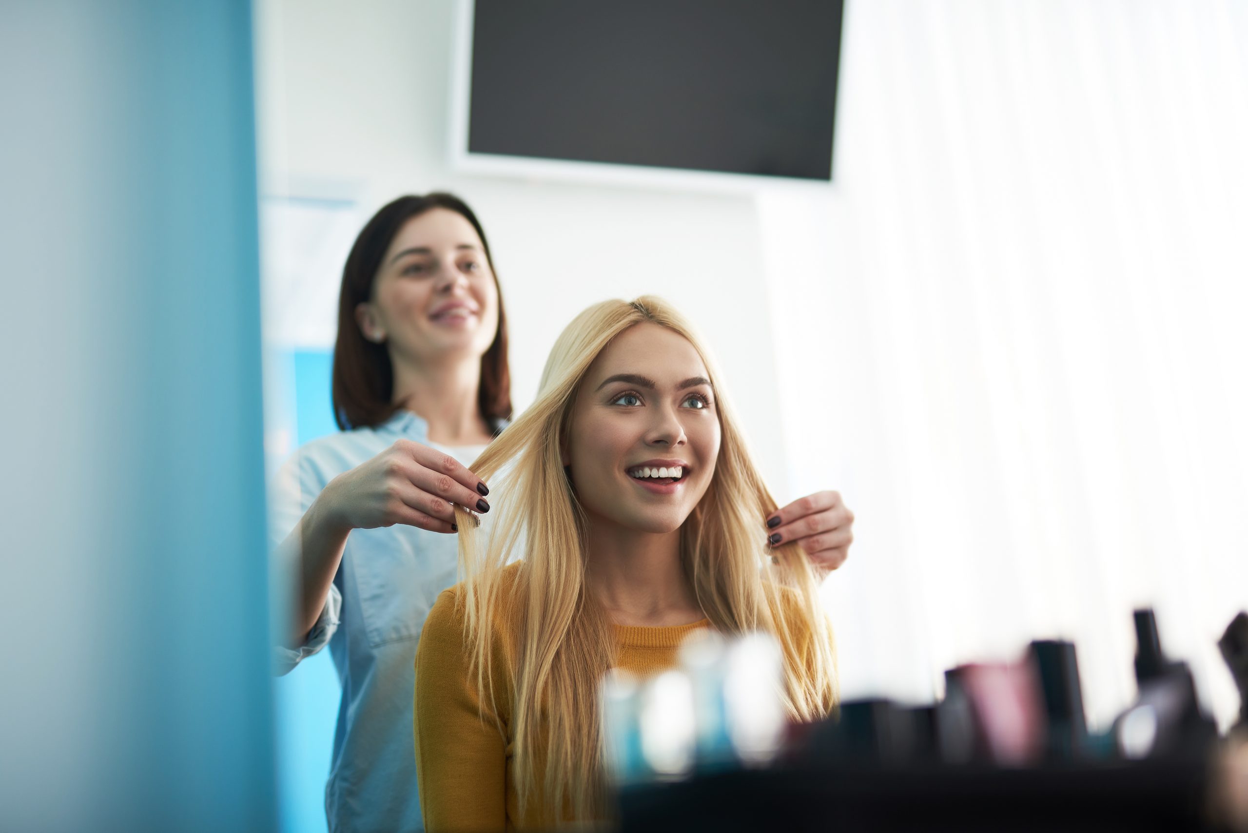 Hairstylist with happy client