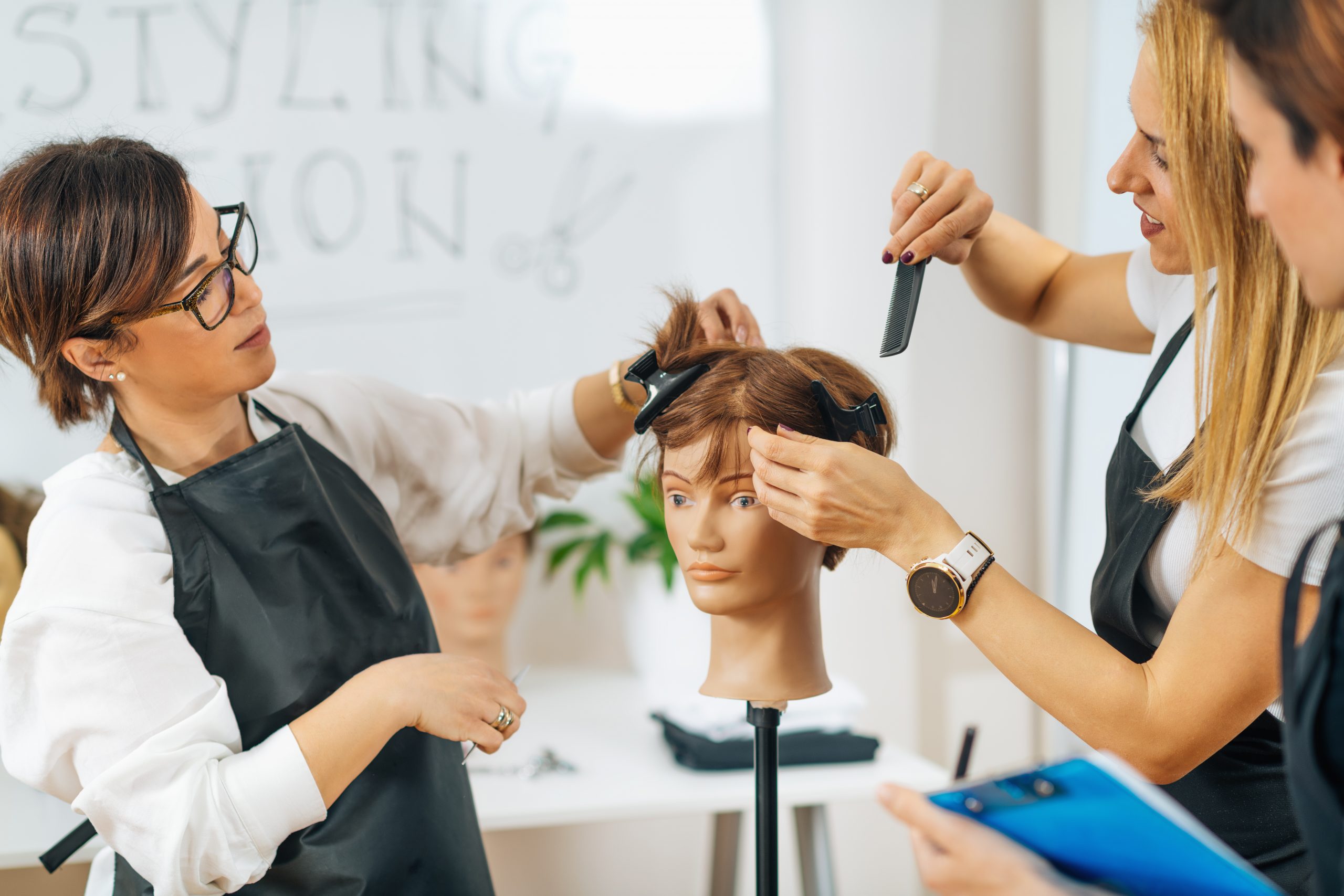 hairdressers training in beauty school