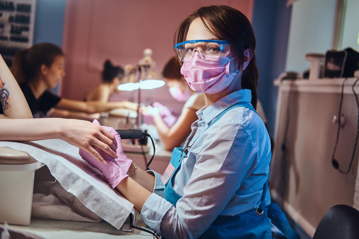 woman getting nails done