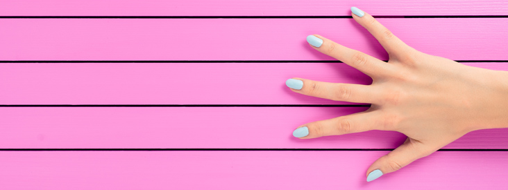 blue manicure pink background