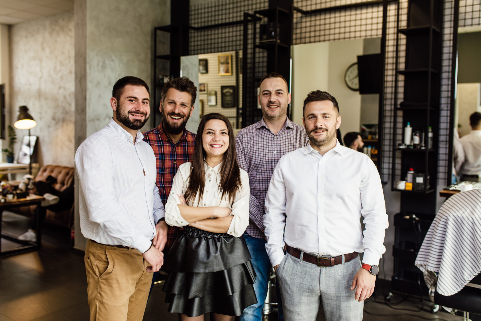 barbers and hairstylists posing 