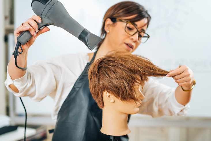 blow drying hair and styling