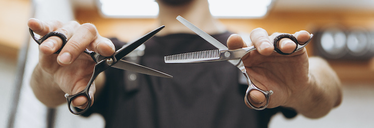 barber holding shears