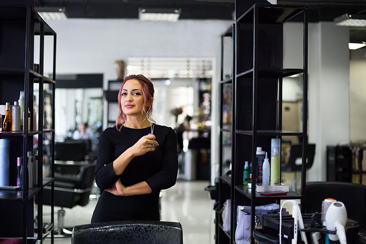 hairstylists holding shears