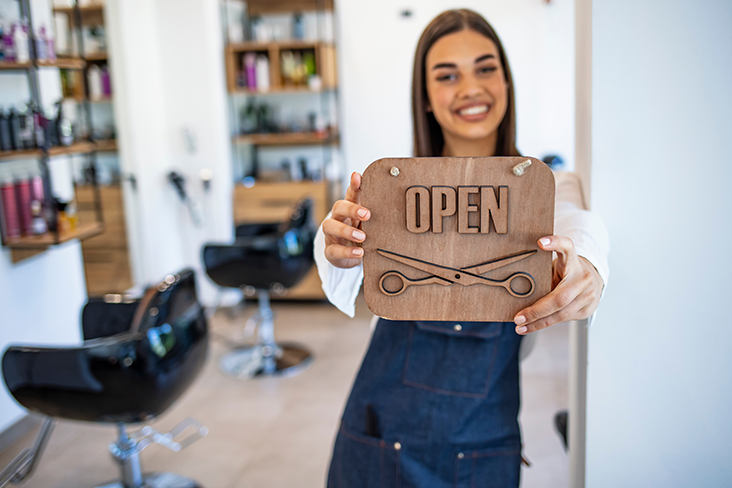 holding an open sign