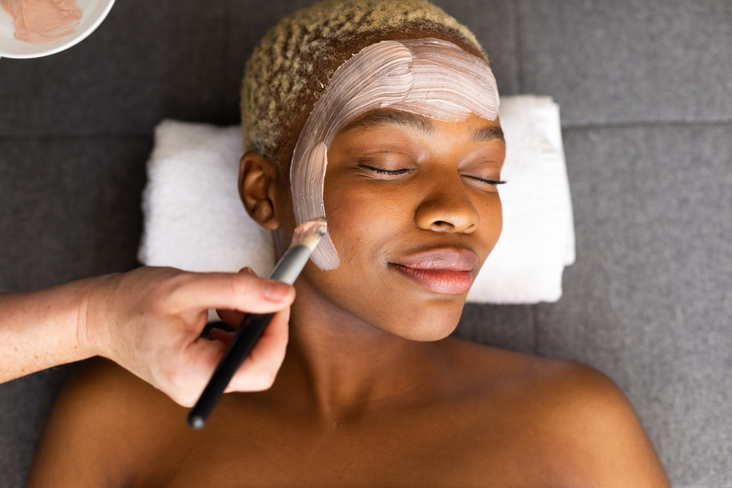 esthetician giving facial