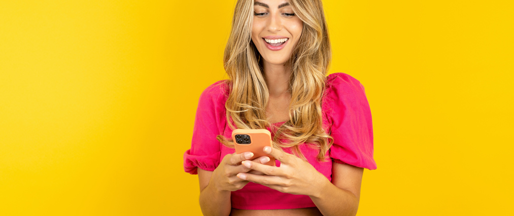 woman posting on her phone featured