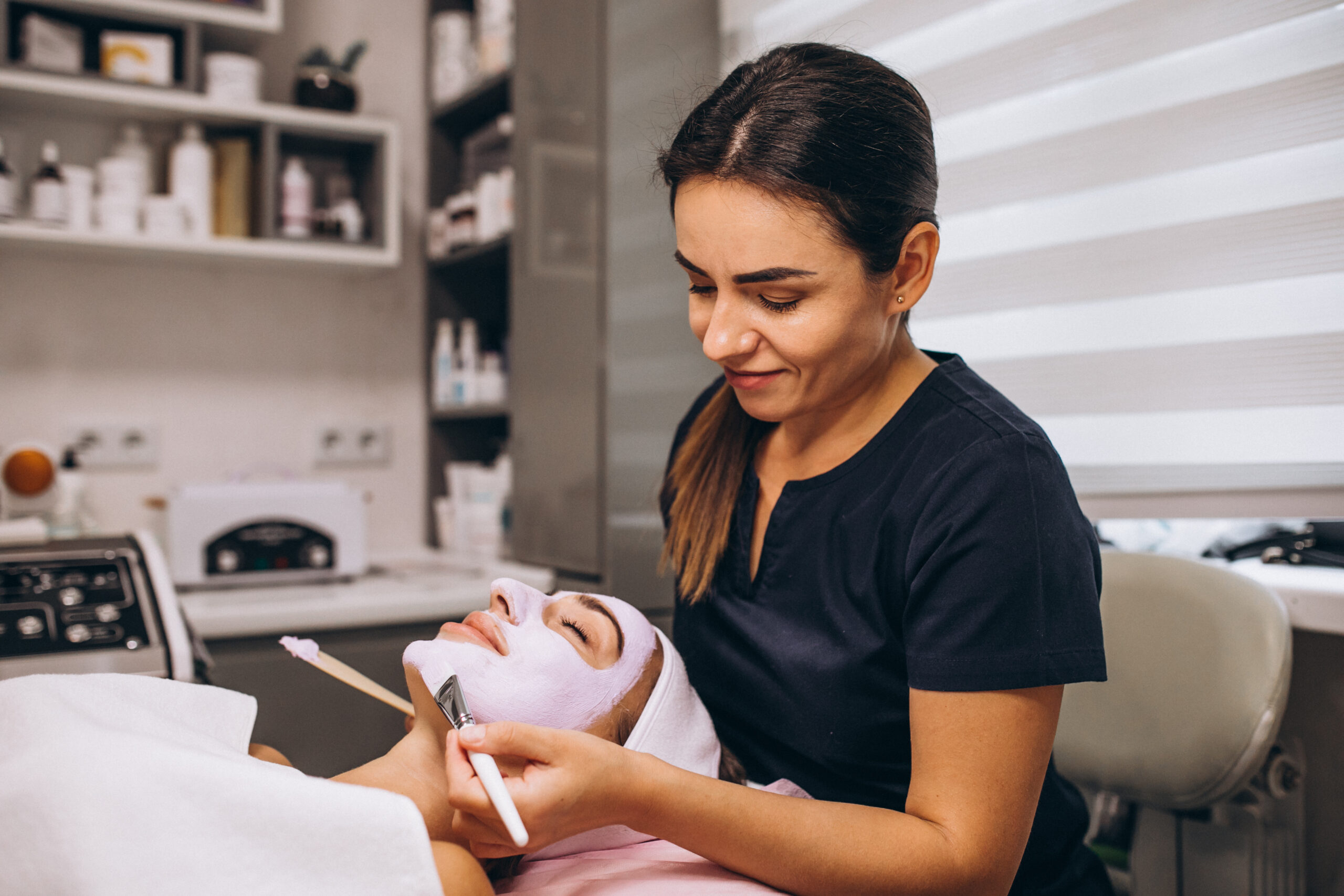 esthetician applying facial