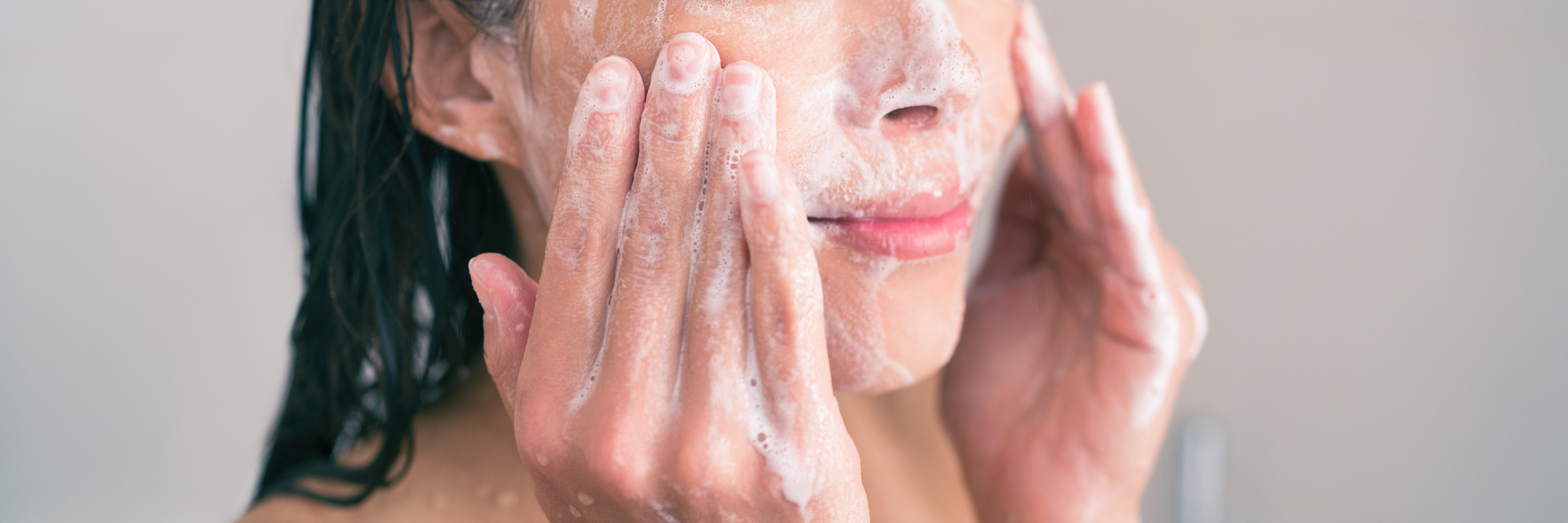 woman washing with cleanser