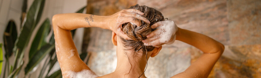 woman washing hair in shower