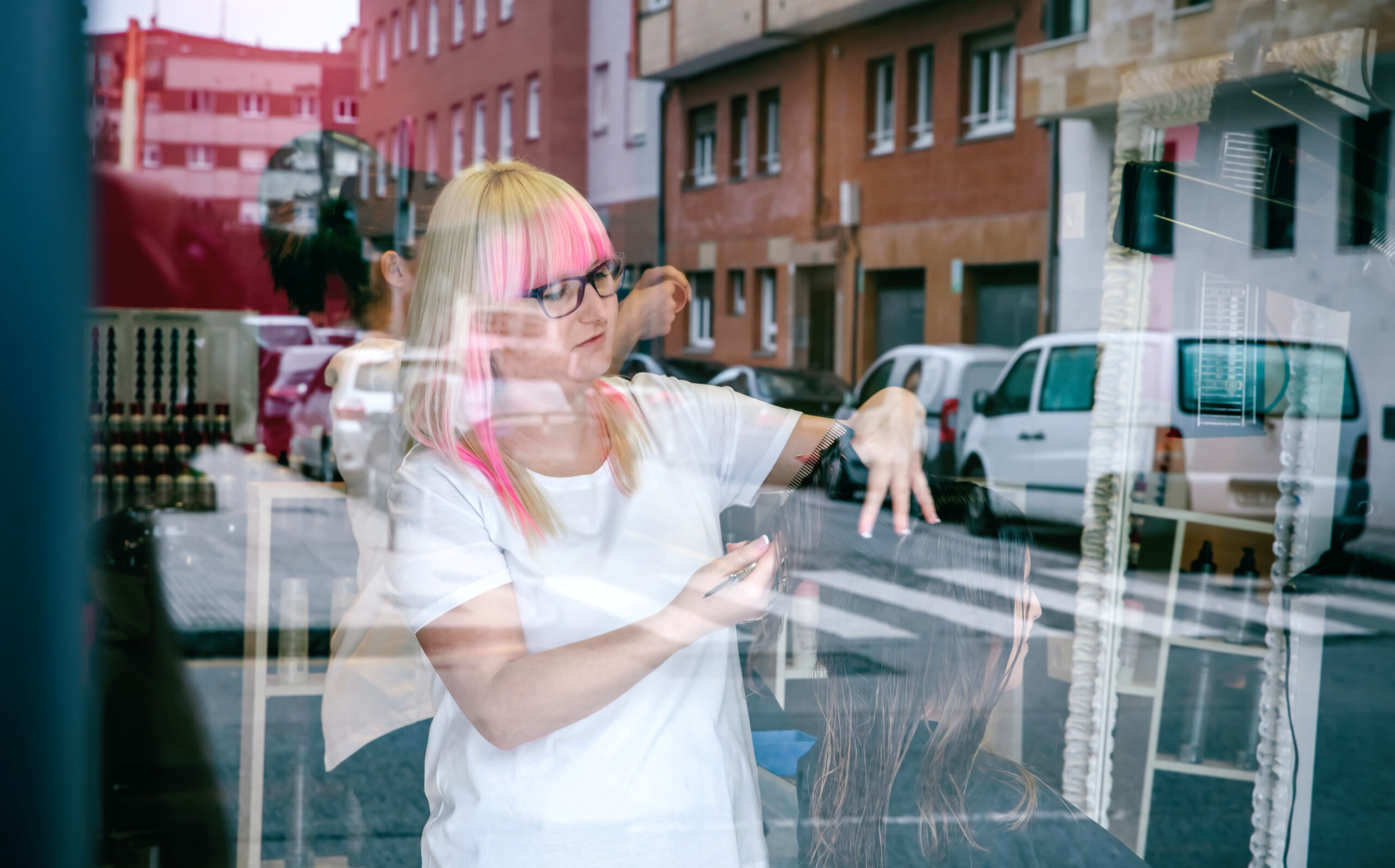 woman cutting hair in salon