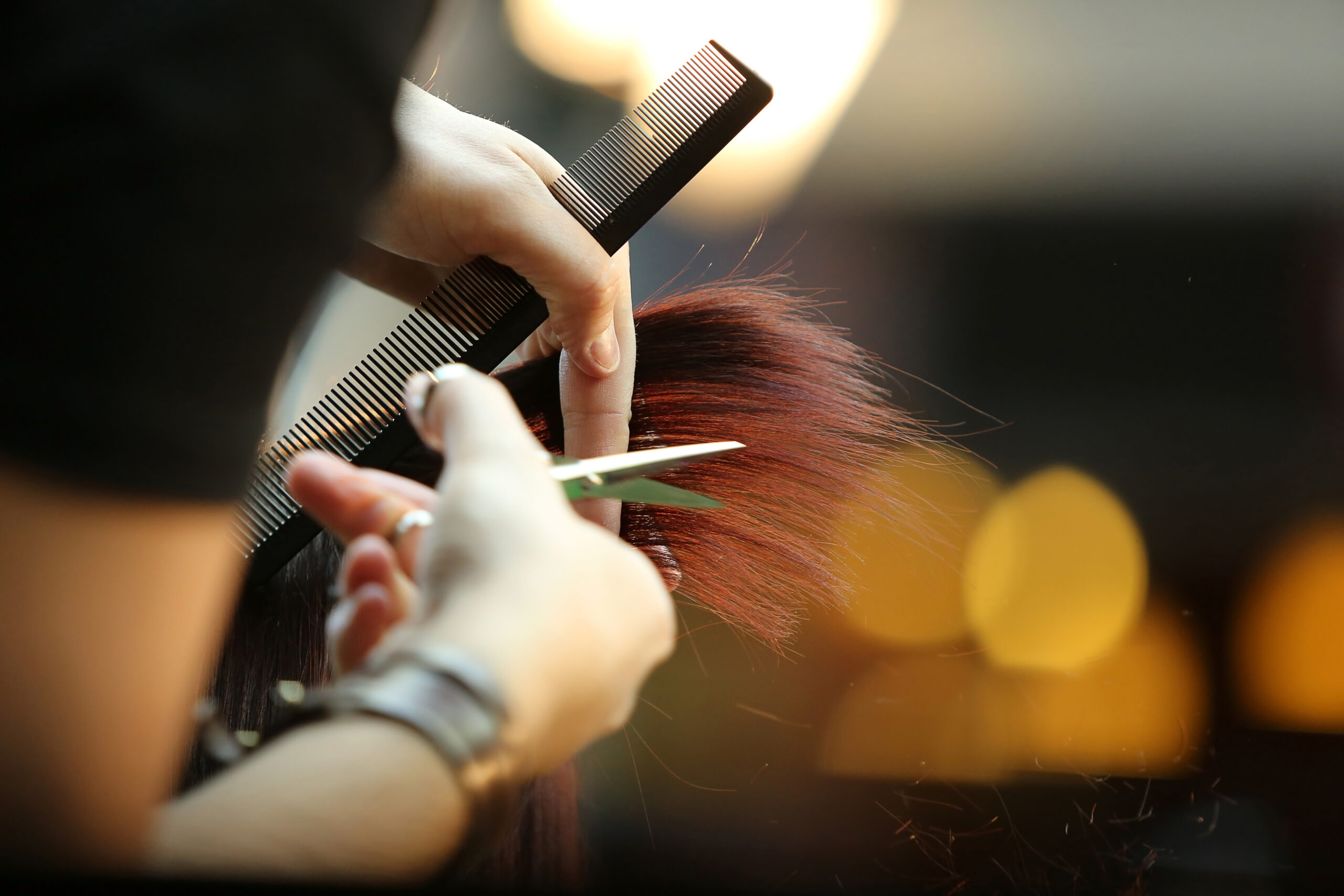 trimming hair with shears