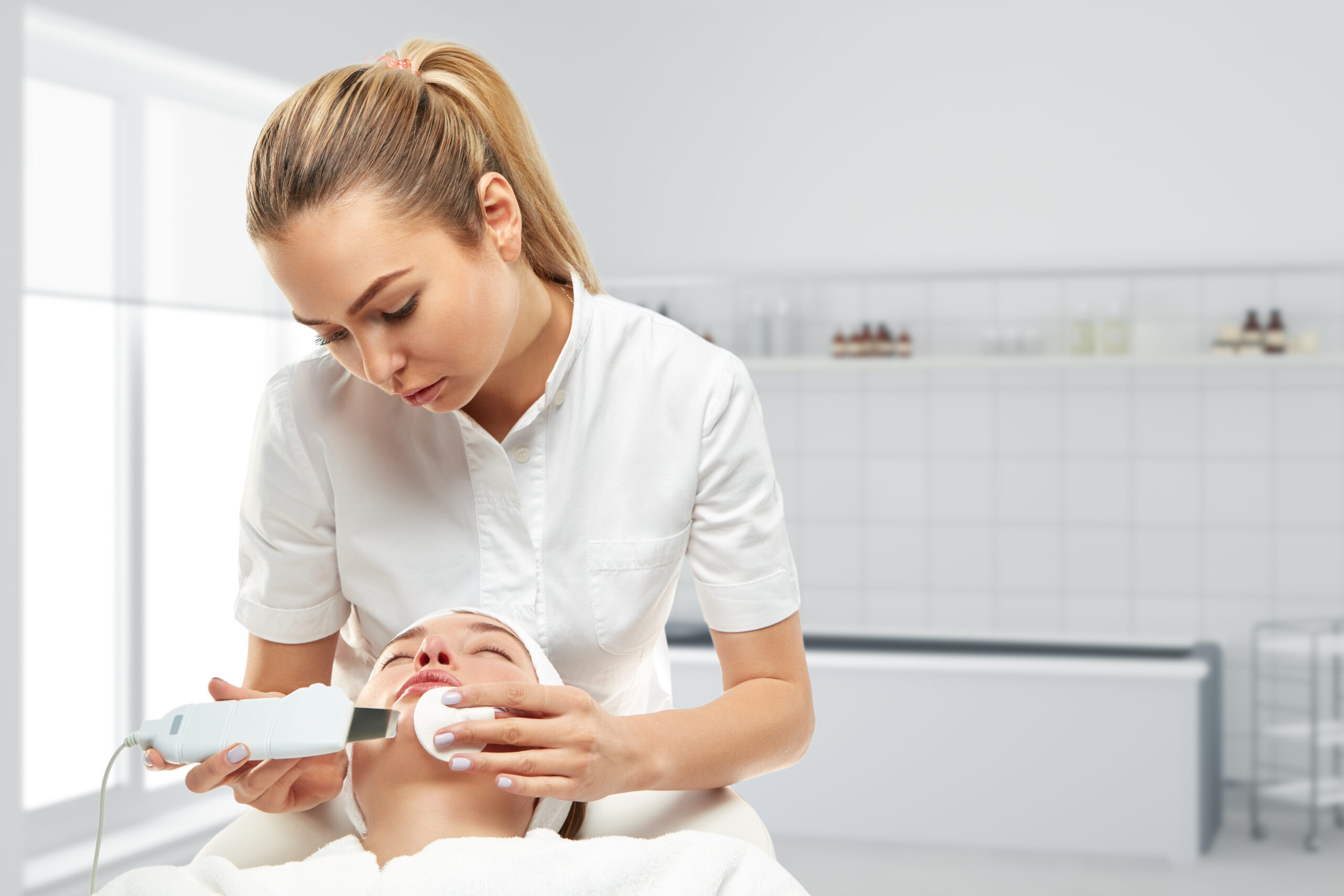 Esthetician performing facial